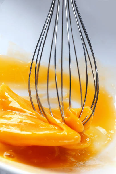 istock Whipping egg whisk. The concept of using eggs in the recipe Macro. 932683850