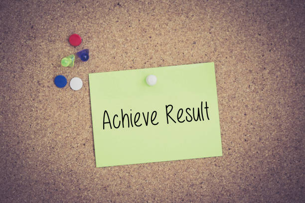 istock Achieve Result written on sticky note pinned on pinboard 932696930