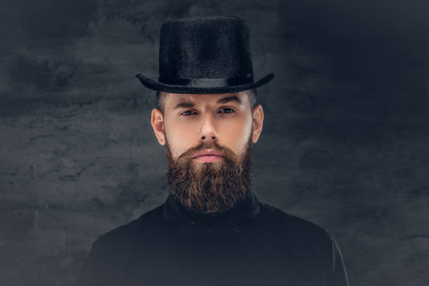 istock Brutal bearded male over grey background. 932697818