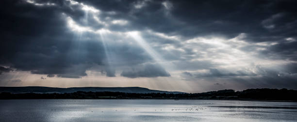 istock Dramatic sunlight over reservoir with wildlife on sparking water 932704130