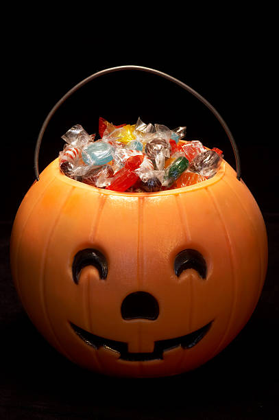 A carved Hallowe'en pumpkin filled with candies