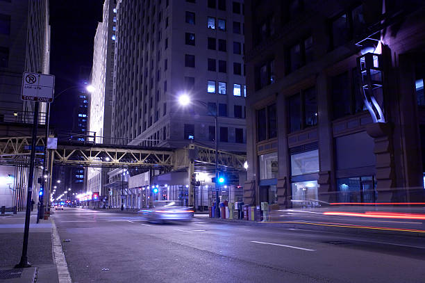 Beautiful evening in downtown Chicago with a clear, starry sky (dozen of them visible at full size), new Moon and bright planet Venus next to it. Willis Tower ( Sears Tower), located on the left. Picture taken on the intersection of Randolph Street and Columbus Drive.