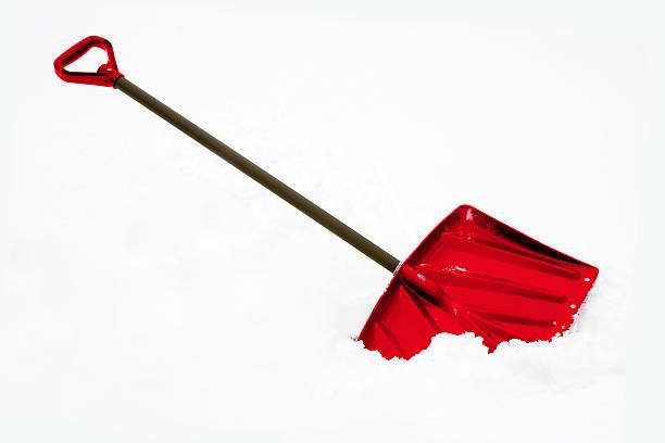Hand-colored snow shovel in deep snow