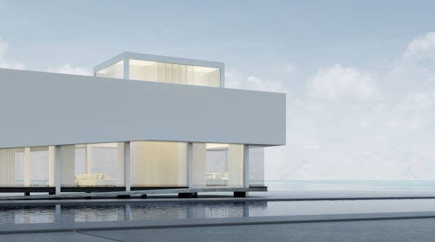 istock 3D rendering of modern architecture with warm interior lighting and minimal pool on mountain background,Concept of design architectural. 932716544