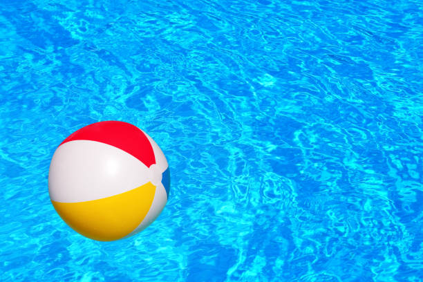 istock Colorful inflatable ball floating in swimming pool 932724334