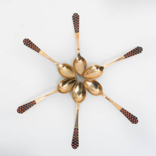 Vintage golden spoon on a white background