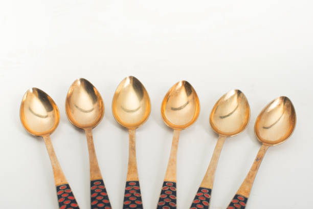 istock Vintage golden spoon on a white background 932724694