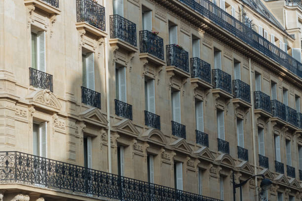 istock Paris residential buildings facades. Old Paris architecture 932725232