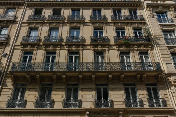 istock Paris residential buildings facades. Old Paris architecture 932725404
