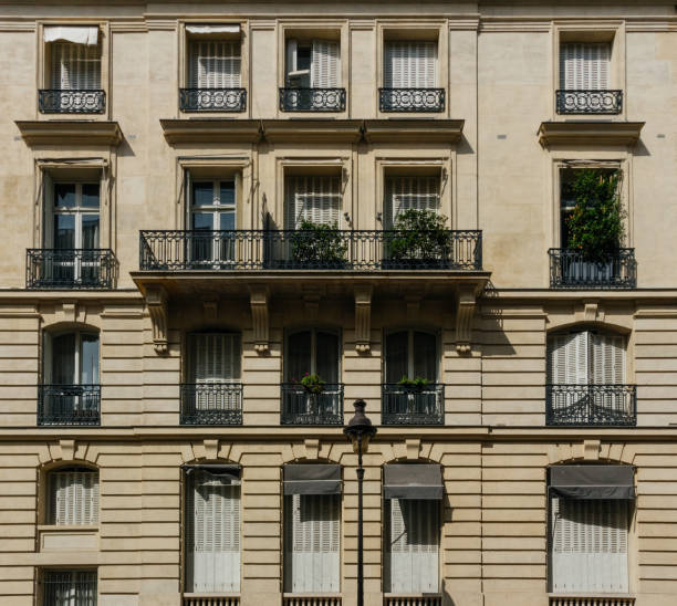istock Paris residential buildings facades. Old Paris architecture 932725518