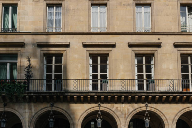 istock Paris residential buildings facades. Old Paris architecture 932725582