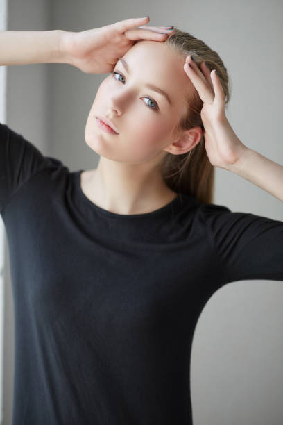 istock Blond woman in a black dress. 932725954