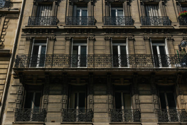 istock Paris residential buildings facades. Old Paris architecture 932726140