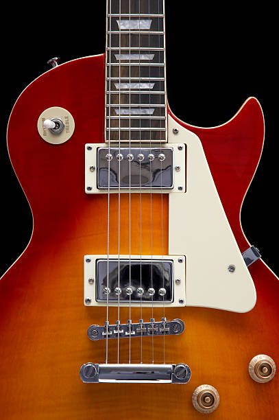 Close-up of an electric guitar on a white background