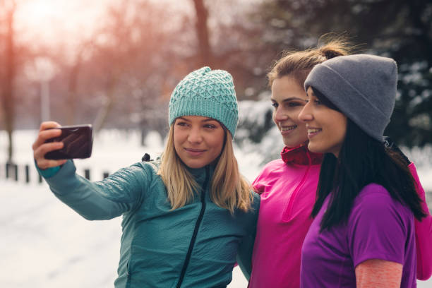 istock Young Women Jogging At Winter Time 932729166