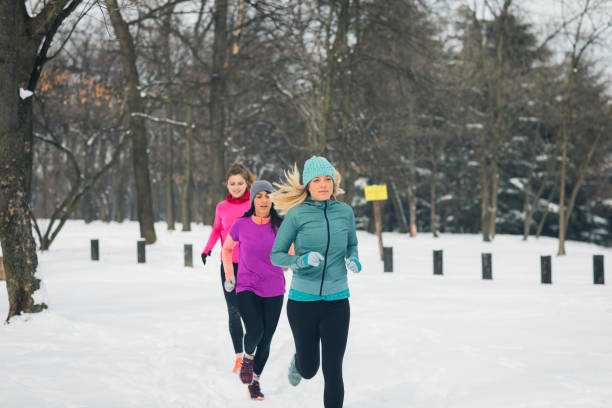 istock Young Women Jogging At Winter Time 932729376