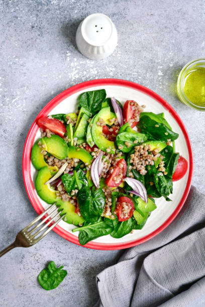 istock Vegetable sald with avocado, baby spinach, tomato and buckwheat 932746950