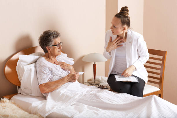 istock Old woman with senior social work assistant. 932747636