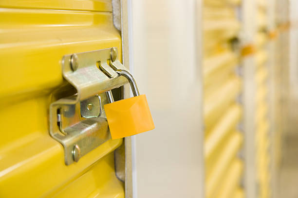 istock Yellow metal storage locker with padlock 93275037