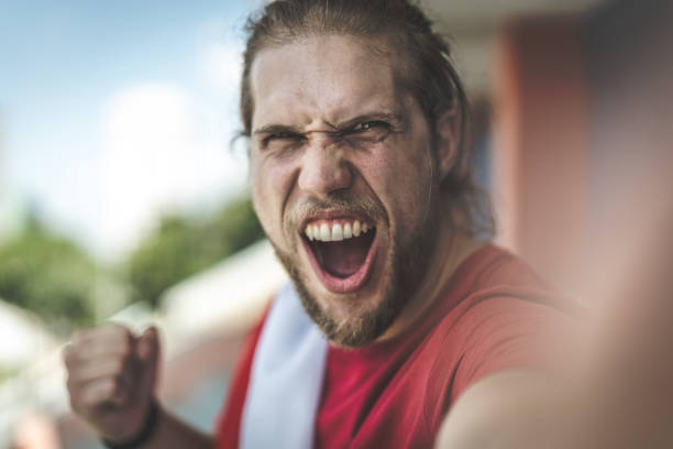 istock Russian fan taking selfie photo during a soccer game 932752218