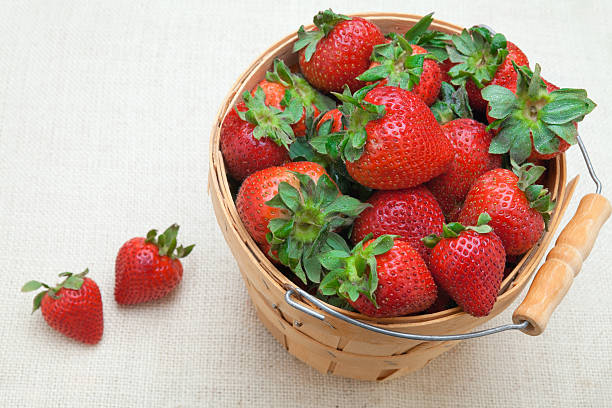 Bushel of fresh strawberries on burlap
