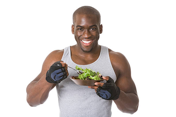 Bodybuilder with Salad  eating body building muscular build vegetable stock pictures, royalty-free photos & images