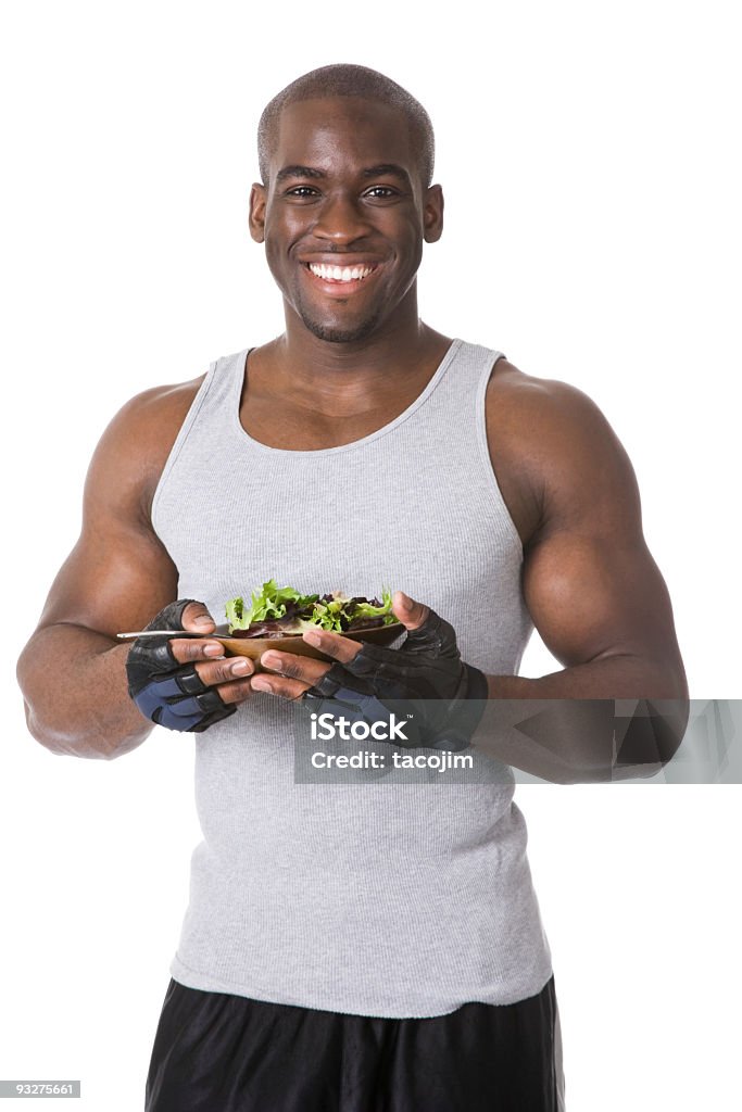 Bodybuilder avec salade - Photo de Manger libre de droits