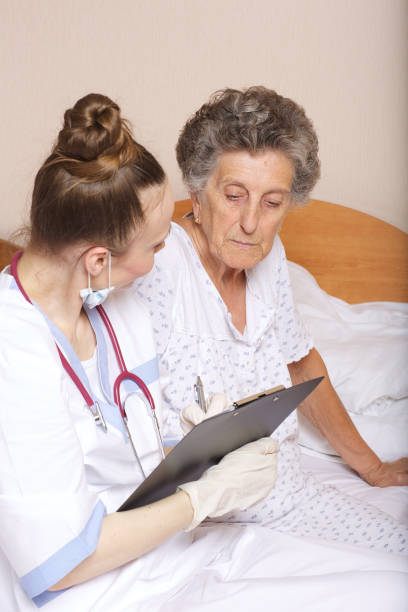 istock Geriatrician visits a senior woman 932758466