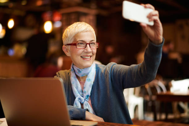istock Senior woman in coffee shop 932760292