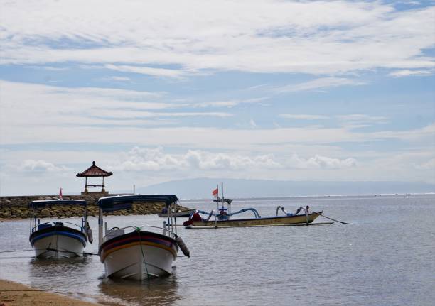 istock Beach in Bali Indonesia blue water boats 932763880