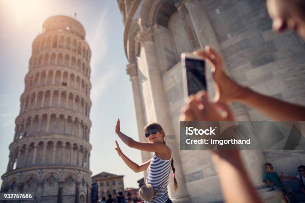 Holding Up Photos Of The Leaning Tower Of Pisa Stock Photo - Download Image Now - Travel, Italy, Tourist