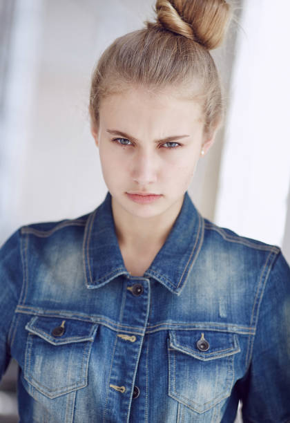 istock Blond female dressed in a denim jacket. 932768180