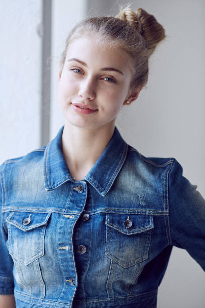 istock Blond female dressed in a denim jacket. 932771758