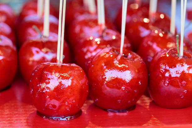 istock Red sweet candy apples on a sticks. 932775142