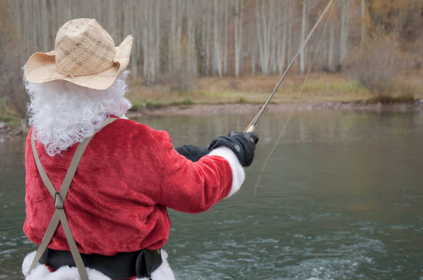 Santa Claus fly fishing stock photo