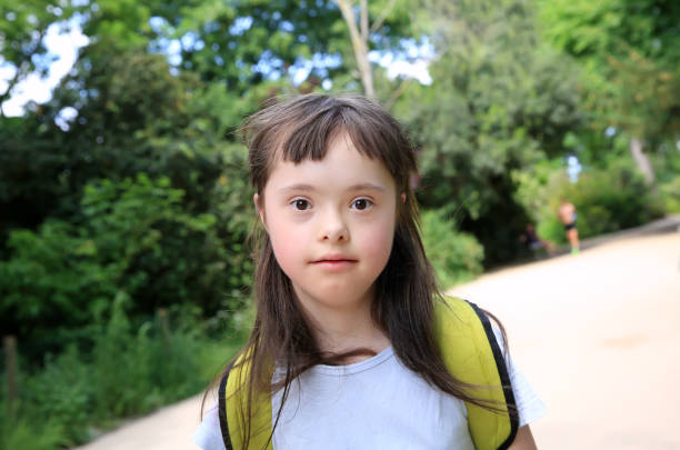 istock Down syndrome girl have fun outside 932782112