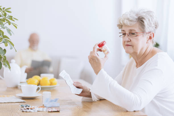 istock Sad senior woman with tablets 932782196