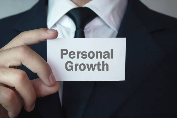 istock Businessman showing Personal Growth text on business card. 932782536