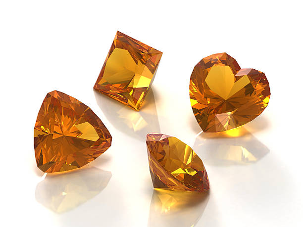 istock Four citrine gemstones of different cuts isolated on white 93278697