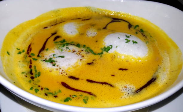 istock Pumpkin cream soup with cream 932790796
