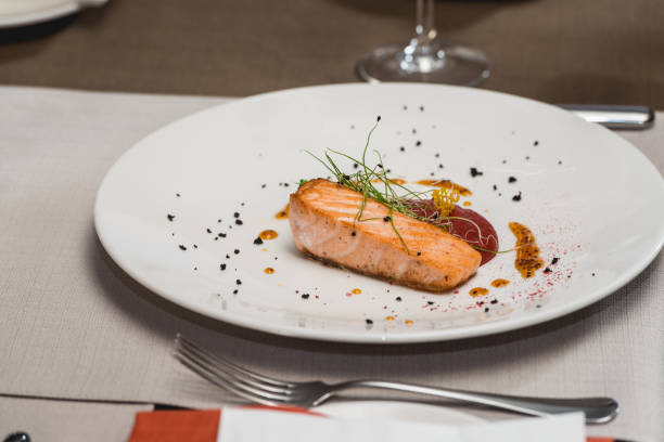 istock delicious salmon in a restaurant. small portion 932793376