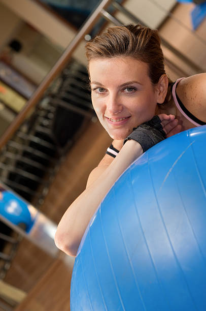 Woman Doing Pilates on Ball stock photo