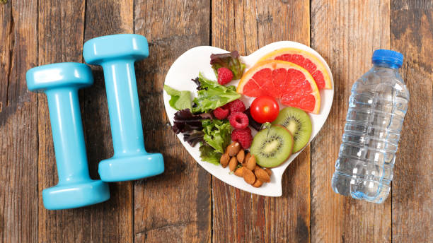 istock healthy eating and dumbbell 932794058