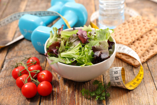 istock healthy eating, salad and dumbbell 932794070