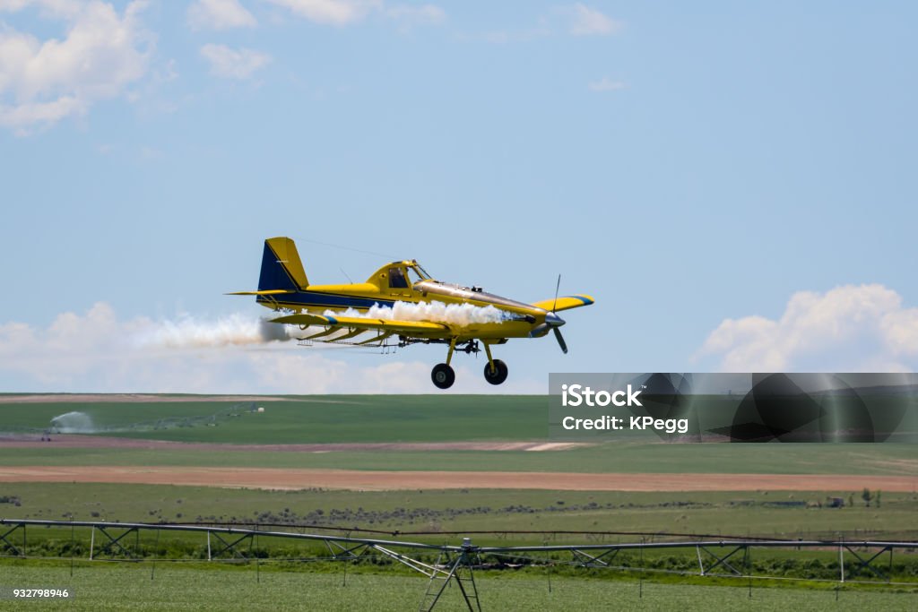 Crop Duster Crop Duster Airplane spraying field Agricultural Field Stock Photo