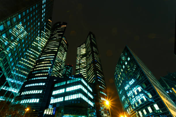 istock Illuminated office buildings in Paris business district. 932799352