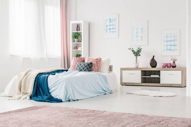 istock Blue and pink bedroom interior 932810782