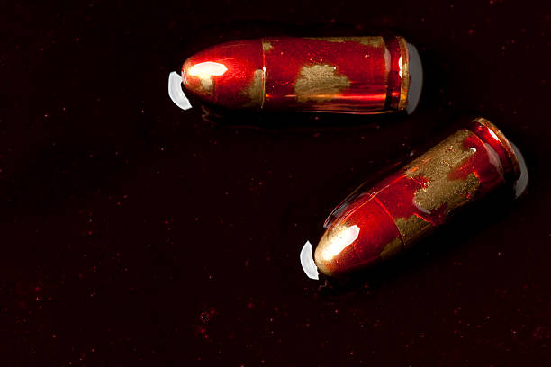 Two bullets in blood stock photo