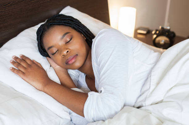istock Businesswoman sleeping in her bed in the morning before work. 932815582