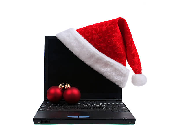 Santa hat on laptop stock photo